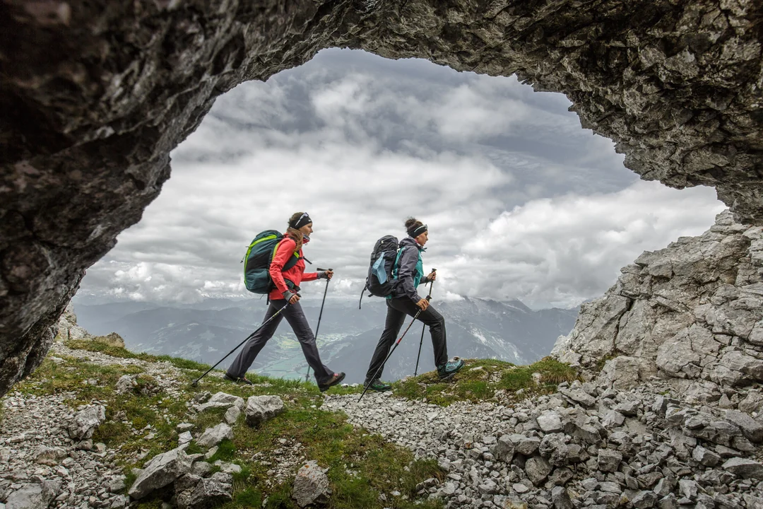 Hikers at a rock arch in the Steinberge – placeholder image